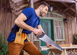 carpenter sawing wood