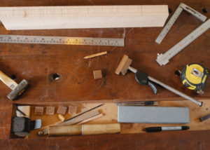 Woodworking square and tools on the table